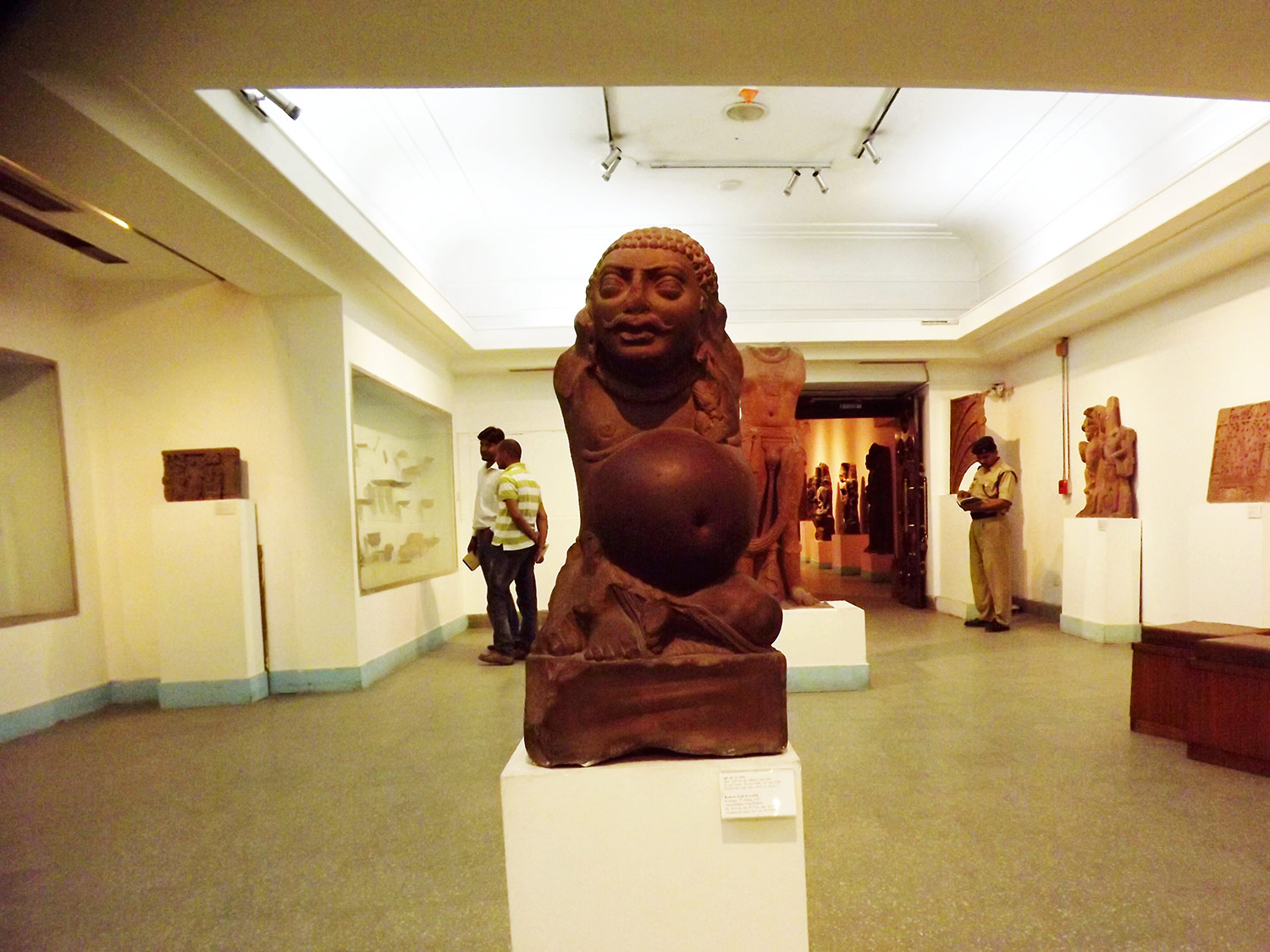 Image is a Farbound.Net photo depicting a sculpture of Kubera, the Vedic Lord of Wealth, on exhibit at the National Museum in Delhi.