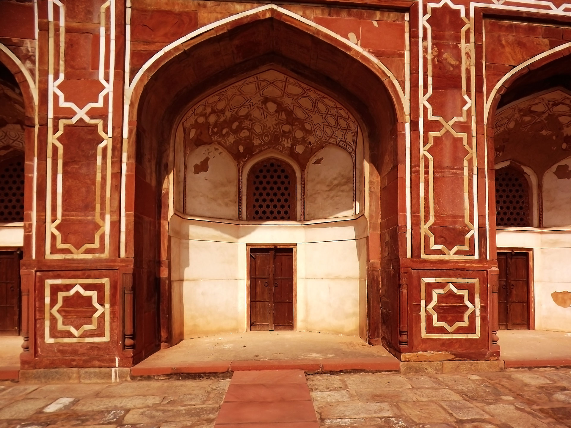 A Farbound.Net photo: Showing the Najmat-al-Quds- an eight pointed geometrical star embellished a pillars unholding the plinth of Humayun's Mausoleum in New Delhi, India