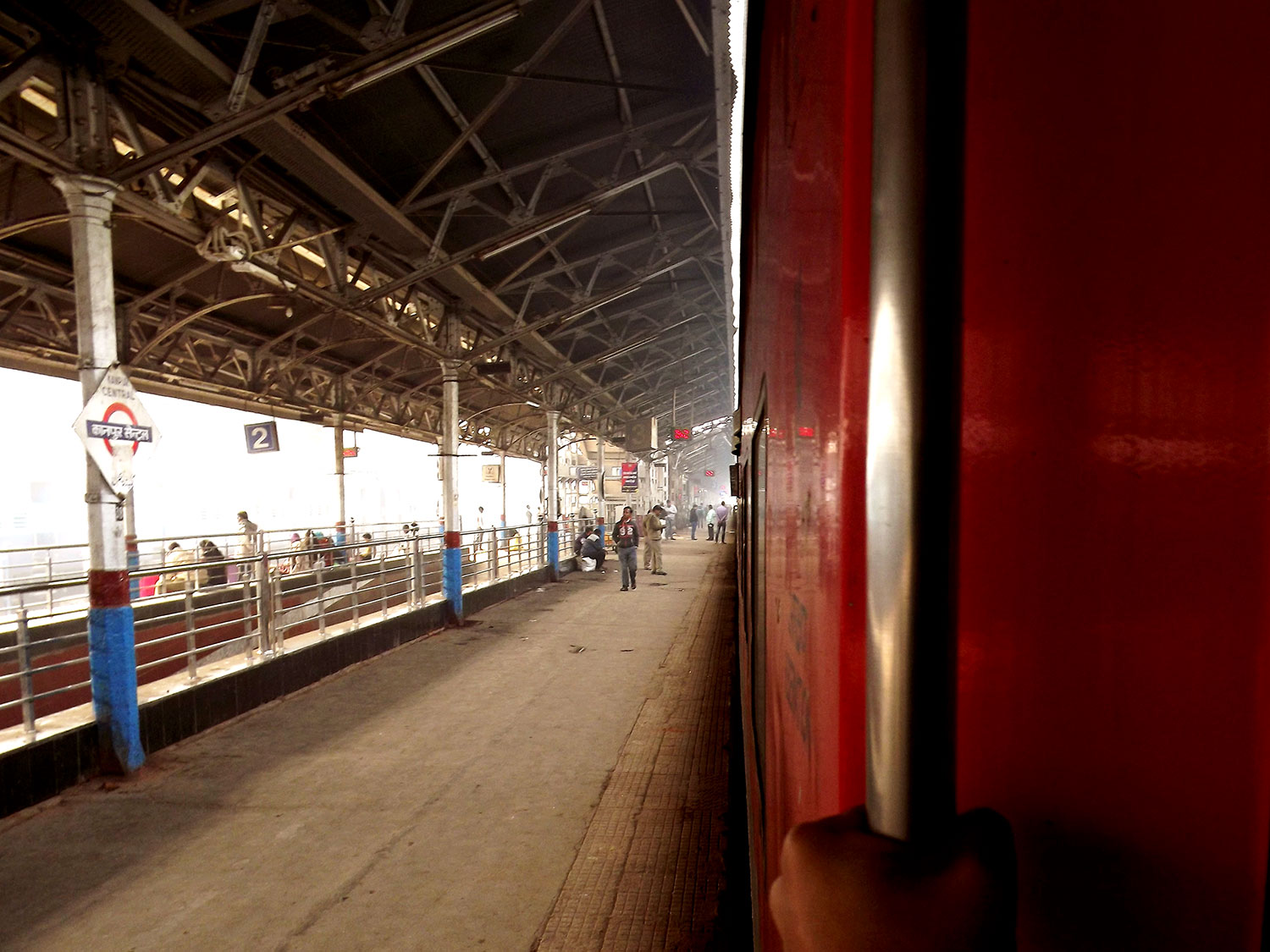 A Farbound.Net Photo showing the Ranchi-Rajdhani departing from a railway station. Visible is a coach of the Ac 3 tire.