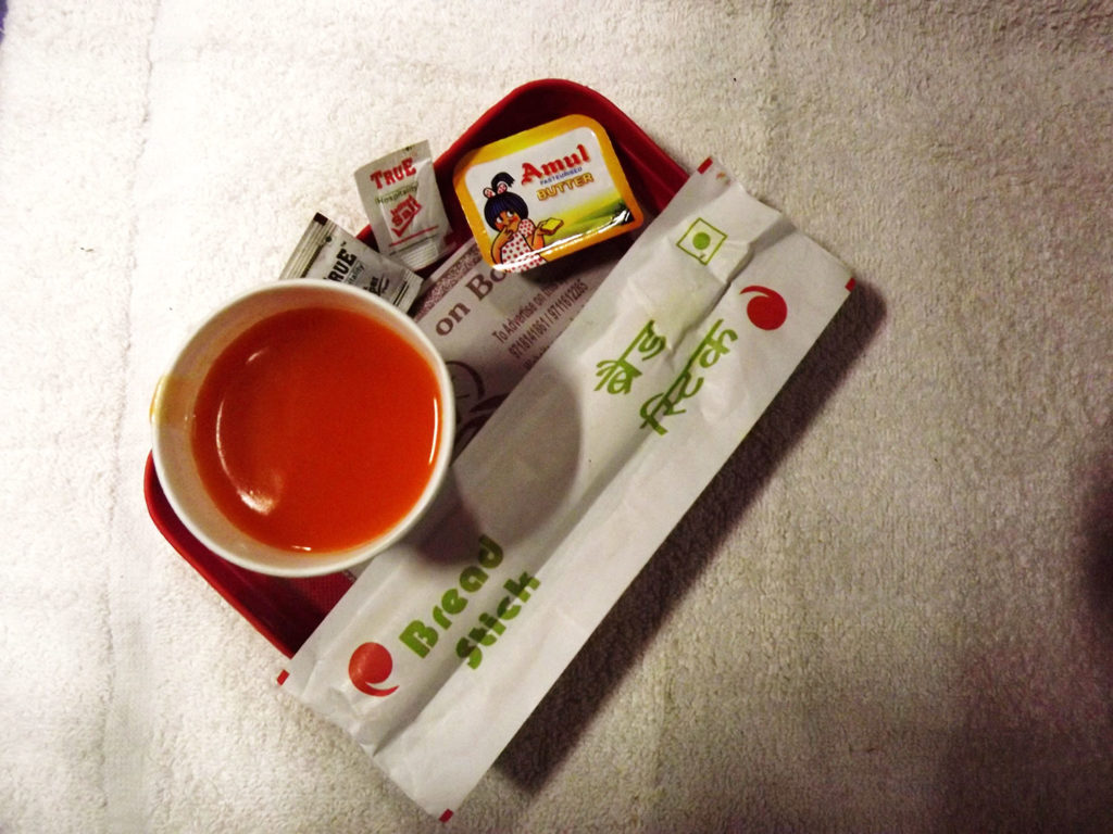 A Farbound.Net Photo showing Bread Sticks and a cup of Tomato Soup placed on a tray onboard a Ranchi-Rajdhani Ac 3 tire coach.