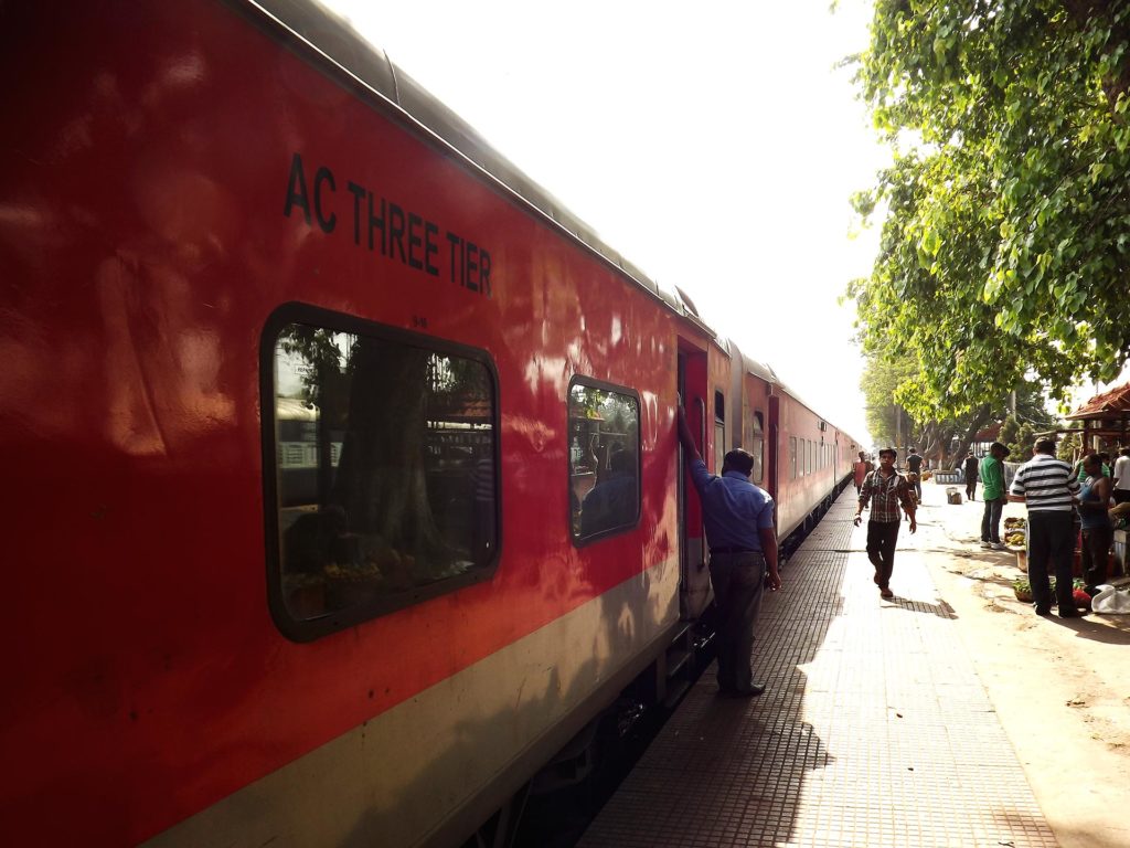 A Farbound.Net Photo showing the Ranchi-Rajdhani at a railway station. Visible is a coach of the Ac 3 tire.
