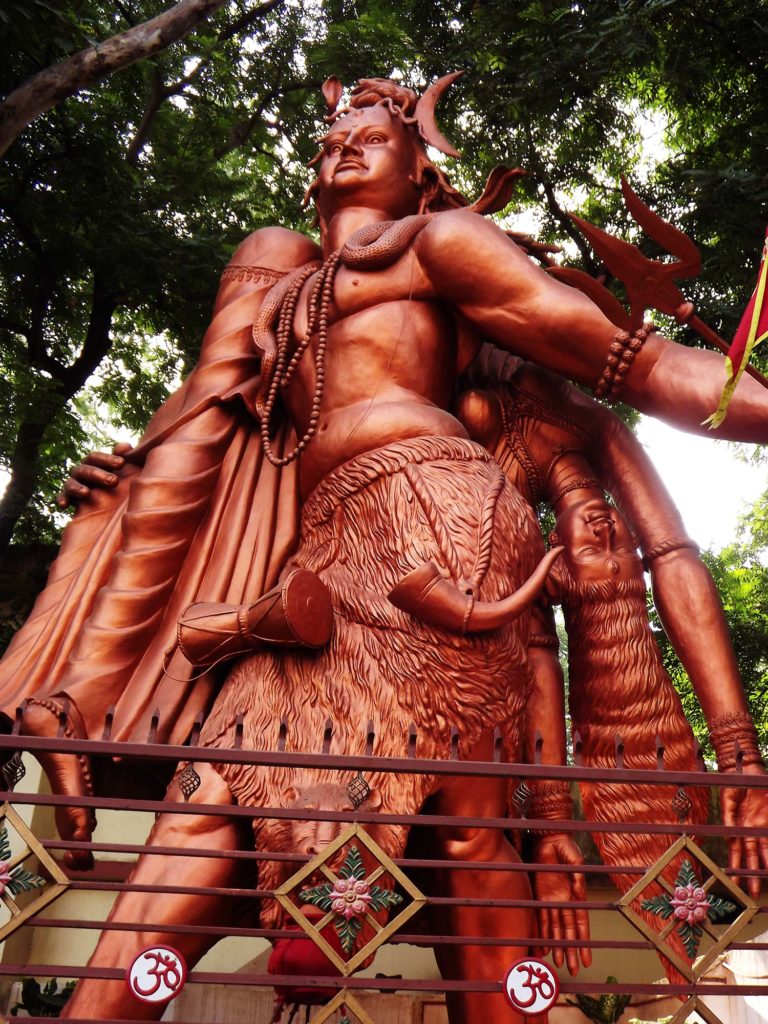 Photo shows a standing sculpture of Shiva carrying his consort Sati in Ranchi, Jharkhand, India