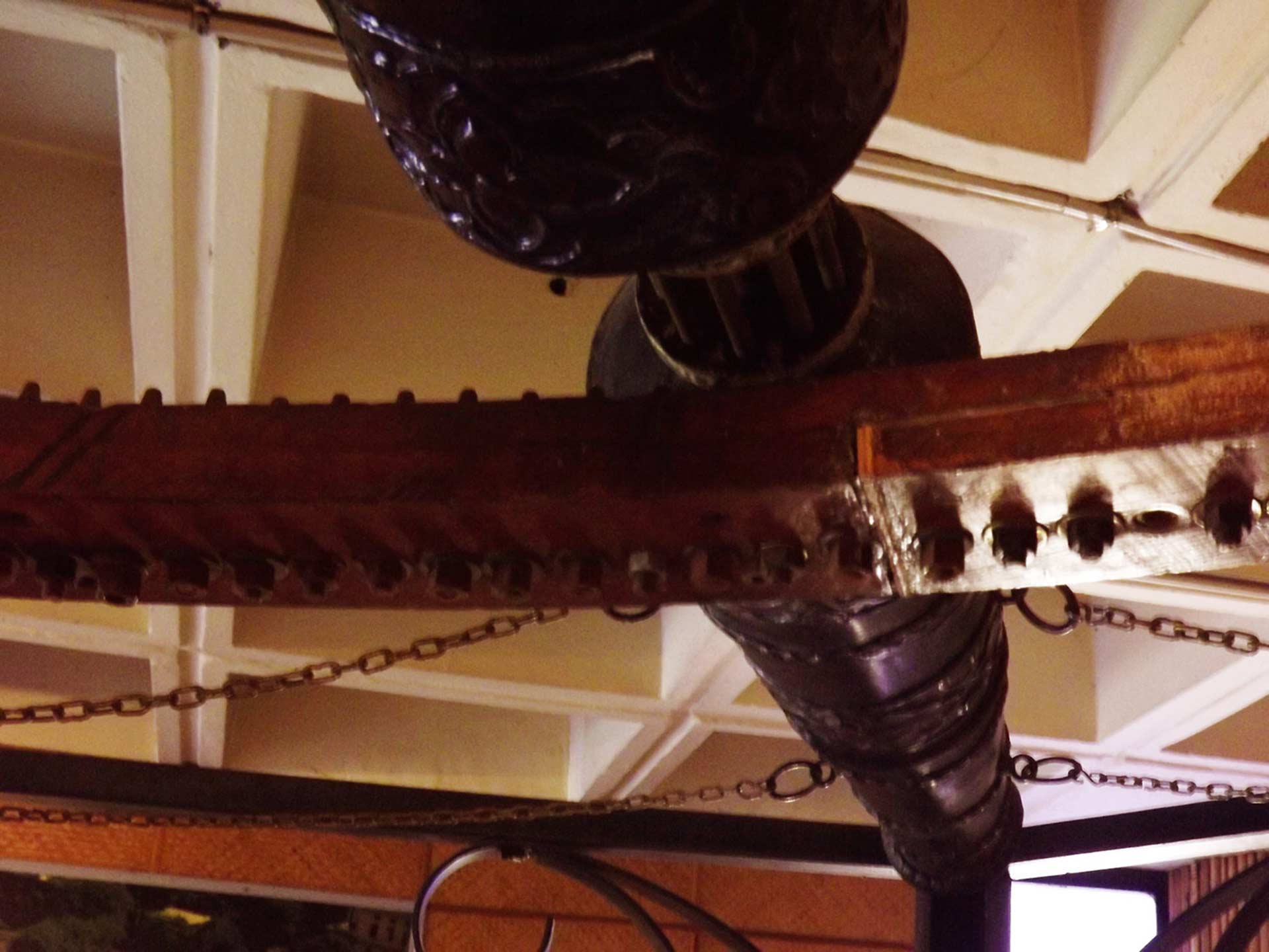 Image is a Farbound.Net photo: Showing a portion of the reconstructed model of the Yarghu with a wheel fitted with protruding iron teeth.
